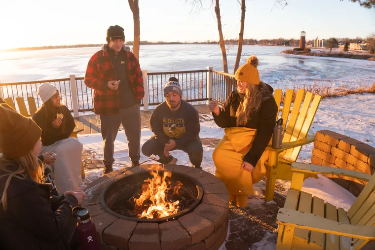 Students Sitting at Fire